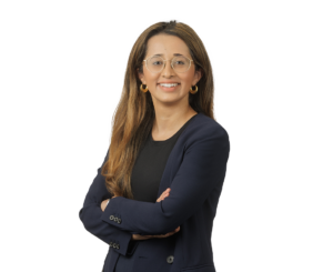 Corporate Attorney - Kynat Akram, woman dressed in a blue business suit
