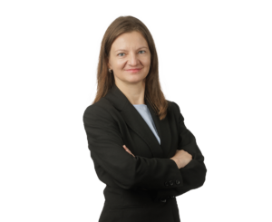 Corporate Paralegal - Valya Varbanova, woman dressed in black business suit